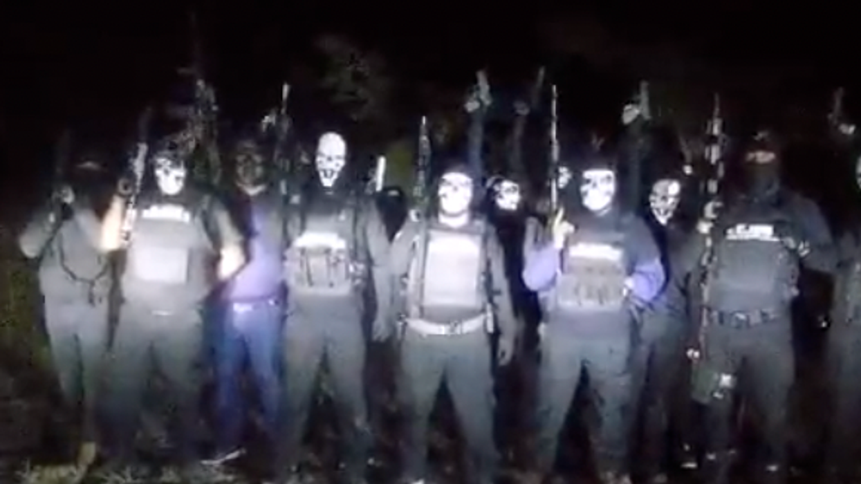 Terrifying gang in Halloween masks say they're going to 'purge' local neighbourhoods in disturbing video