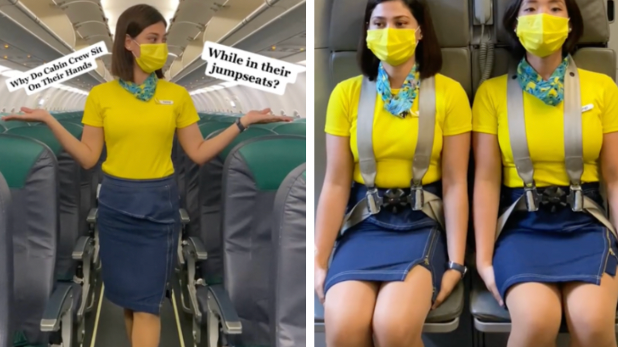 Why do cabin crew sit on their hands during flights?