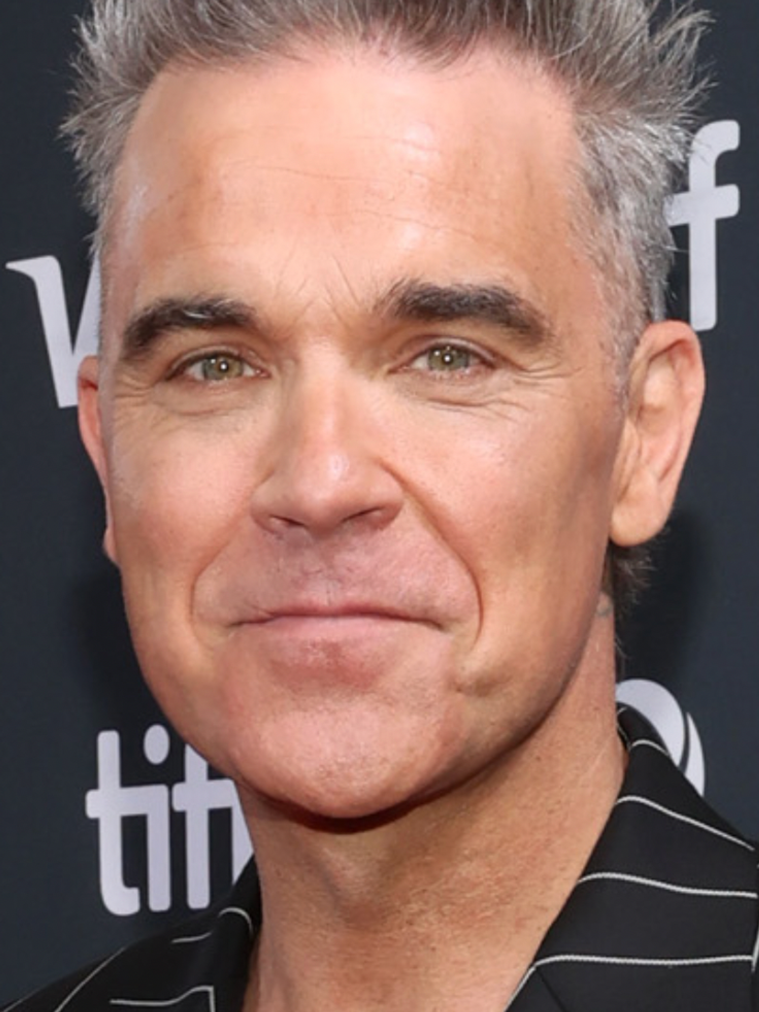 Brits defend Robbie Williams after Americans say they have no idea who he is upon biopic release