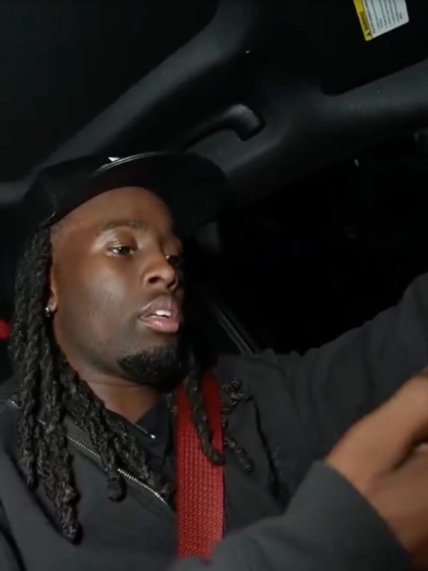 Kai Cenat faces calls for a Twitch ban for looking at his phone while driving