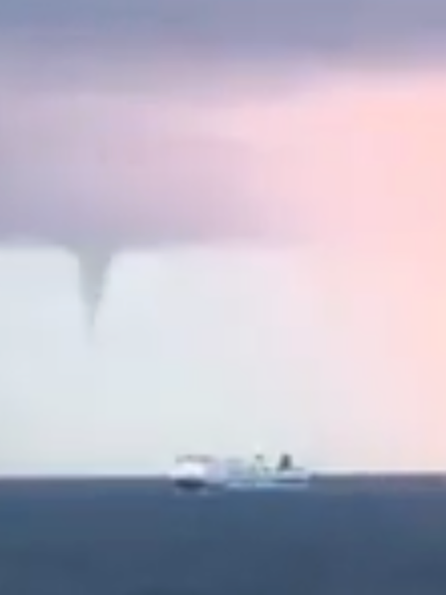 Watch as tornado whirls past cruise ship in dramatic footage