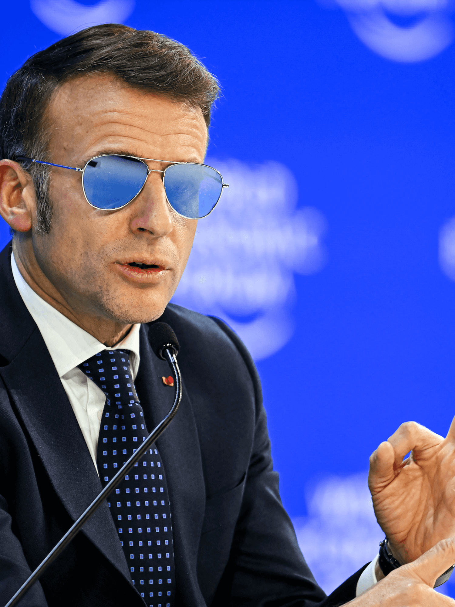 Why was Emmanuel Macron wearing sunglasses at the World Economic Forum in Davos?