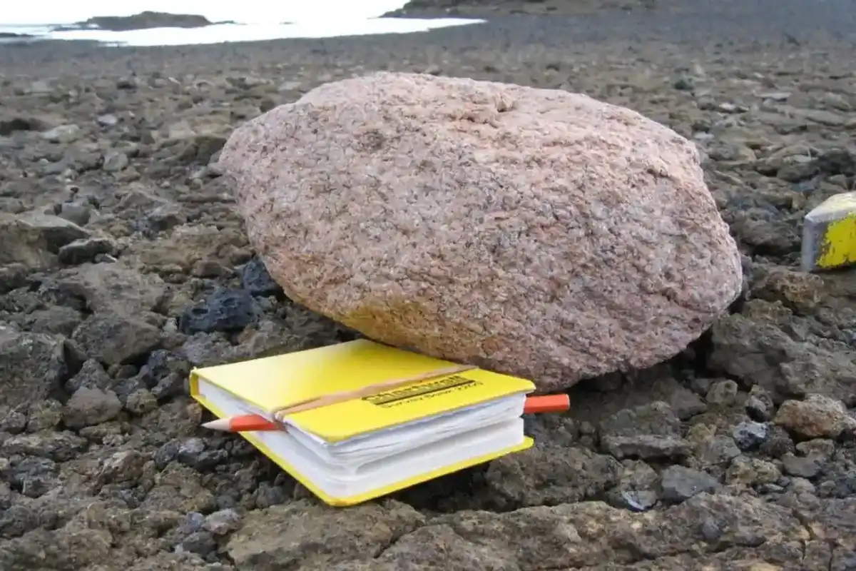 Giant pink boulders sitting on a hidden underworld discovered on Antarctic mountain
