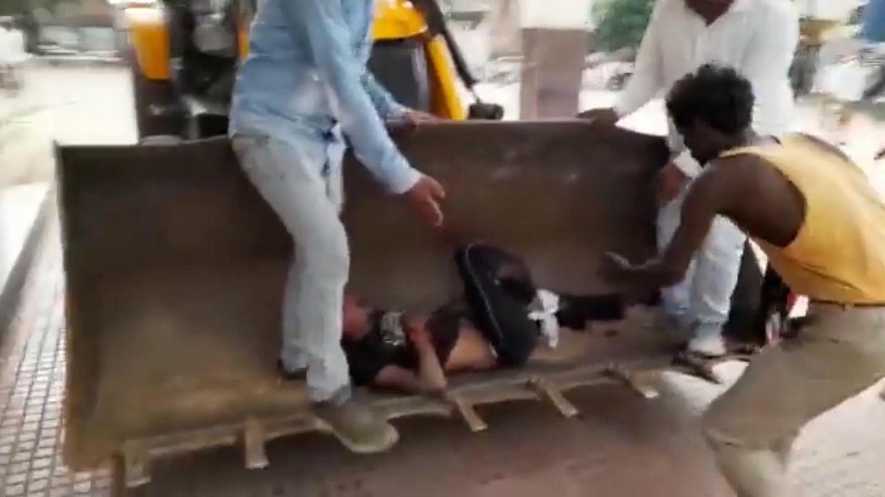 Hurt man fed up of waiting for ambulance got taken to hospital in the bucket of digger