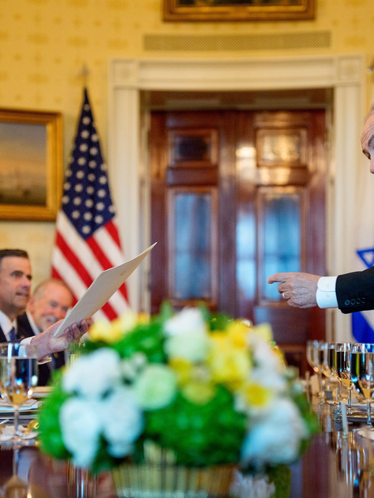 Israeli Prime Minister Benjamin Netanyahu (R) hands off a letter Netanyahu sent to the Nobel Peace Prize committee to nominate U.S. President Donald Trump (L) for the Nobel Peace Prize