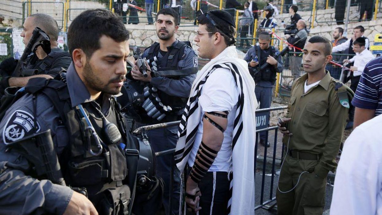 Israeli security forces secure the scene after the attack