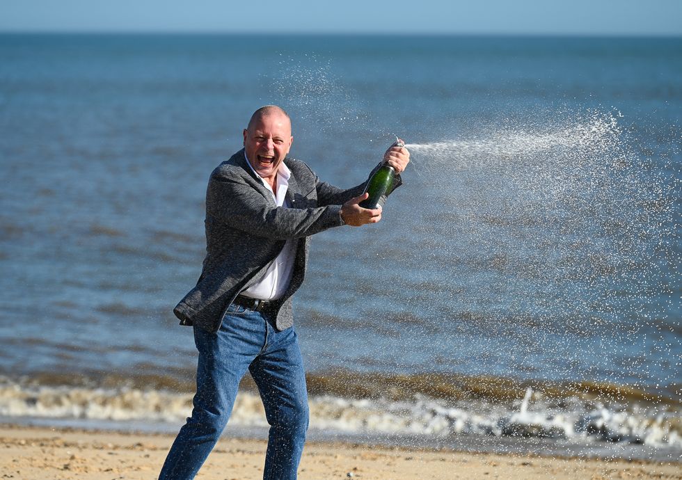 IT worker John Lingard, 66, of Great Yarmouth, celebrates his \u00a3500,000 lottery win a year after he had cancer surgery. (National Lottery/ PA)