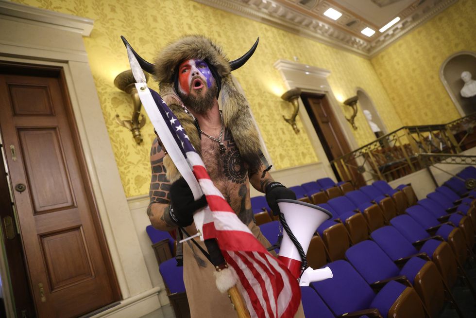 Jacob Chansley inside the Senate chamber. (Photo by Win McNamee/Getty Images)