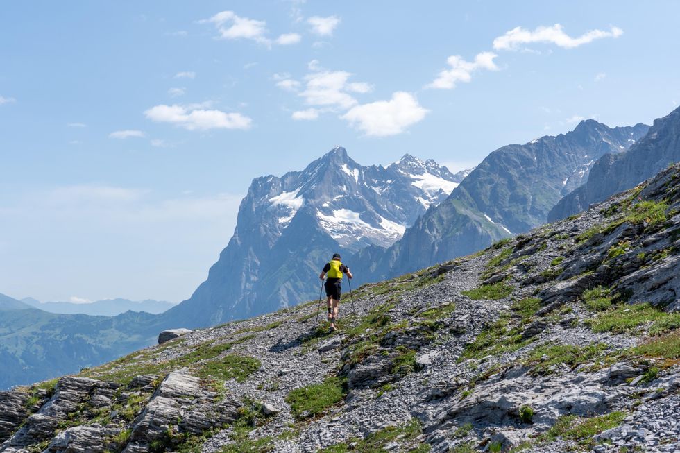 Jake Catterall running along the side of a mountain in Switzerland