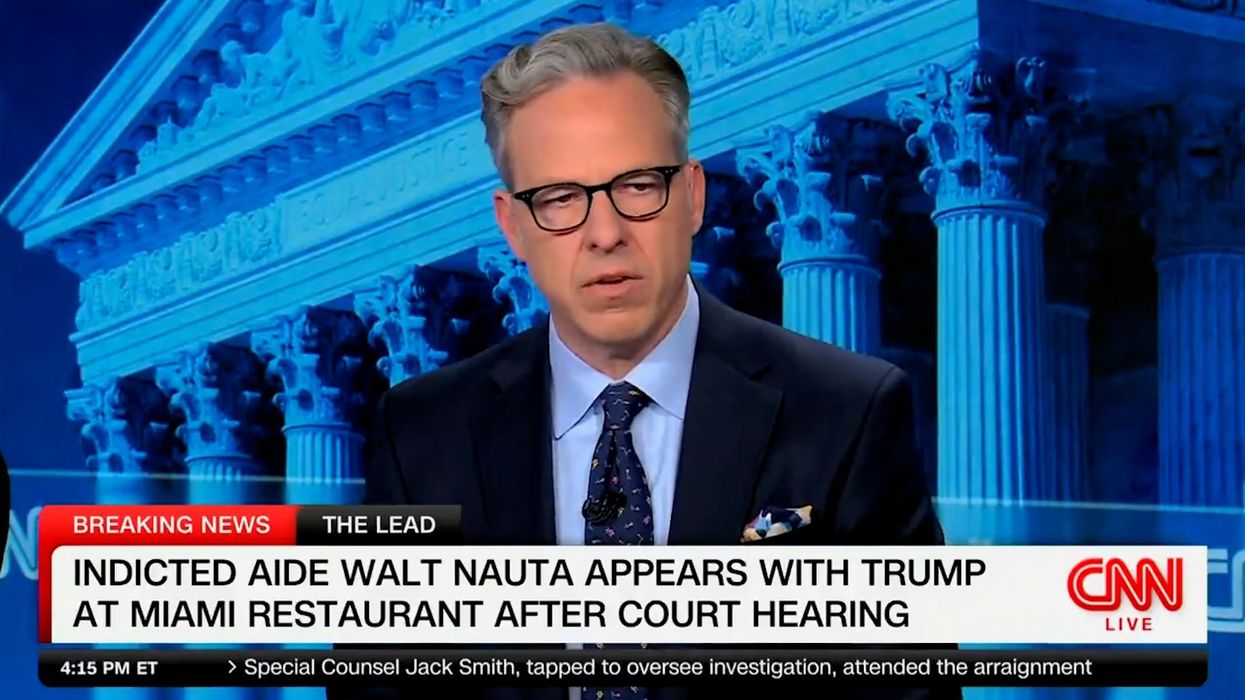 CNN host demands cameras cut away from Trump making a 'spectacle' of his charges