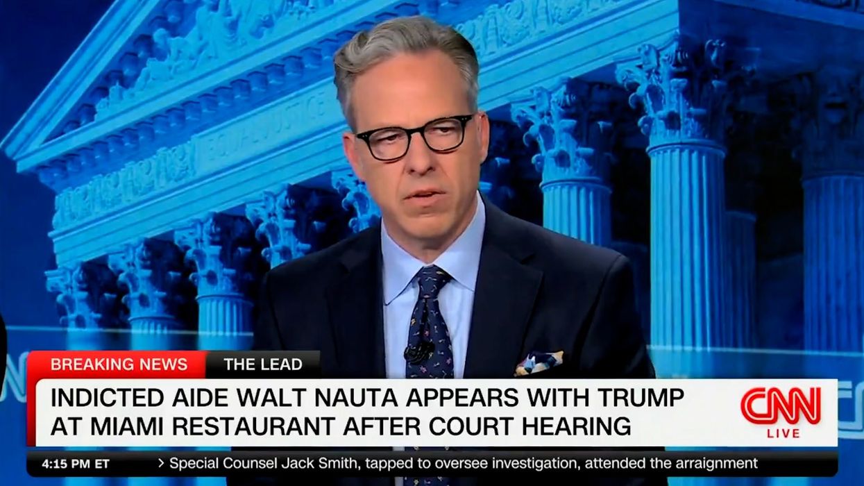 CNN host demands cameras cut away from Trump making a 'spectacle' of his charges