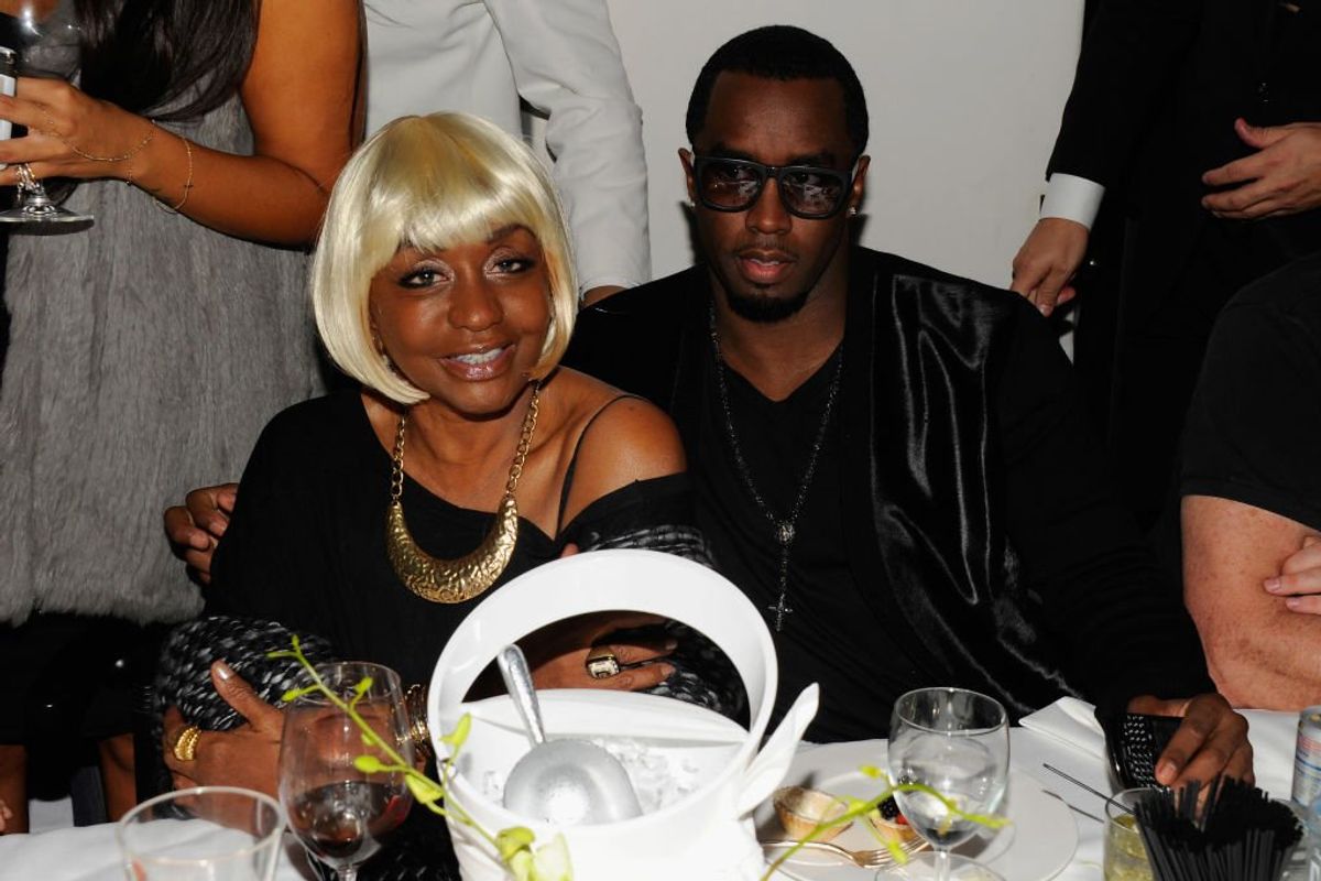 Janice Smalls Combs sits beside her son, Sean "Diddy" Combs, during an event at Mr. Chow's on December 2, 2011 in Miami, Florida