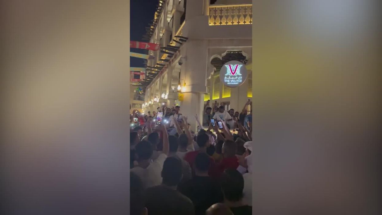 Japanese fans join in singing Arabic songs on the streets of Qatar during World Cup
