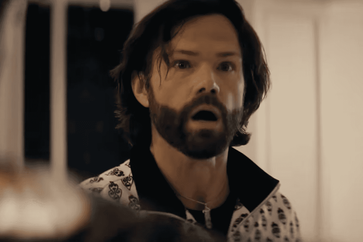 Jared Paledecki as Mr Marathon in The Boys. He is a bearded white man with short black hair.