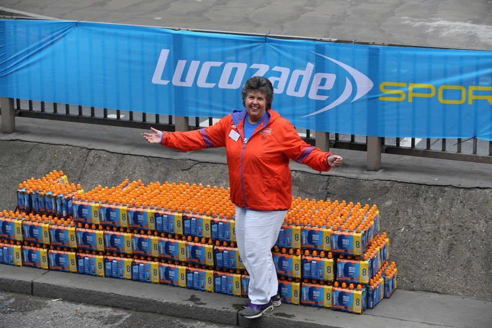 Jasmine Flatters at her Lucozade Sport drinks station (Jasmine Flatters/PA)