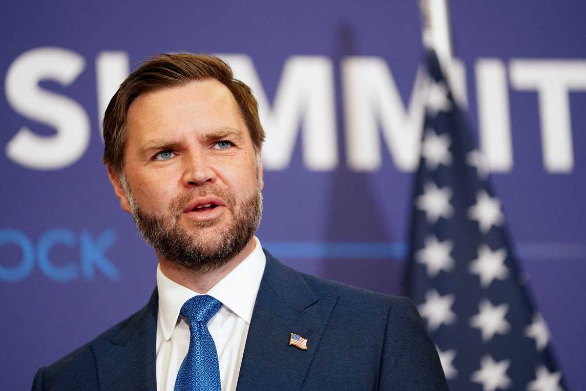 JD Vance in a blue suit at the Iran peace summit.