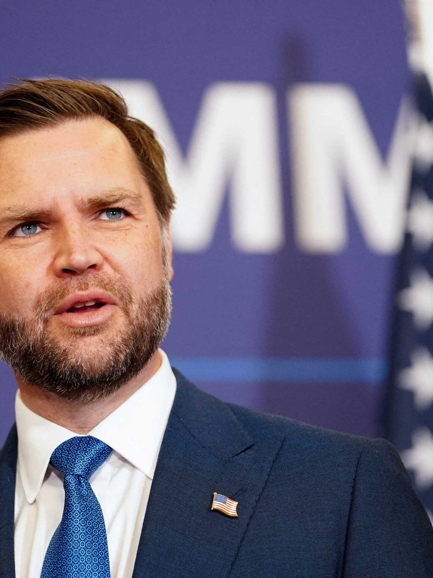 JD Vance in a blue suit at the Iran peace summit.