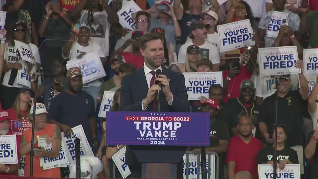 Trump supporters’ signs behind JD Vance accidentally send a different message