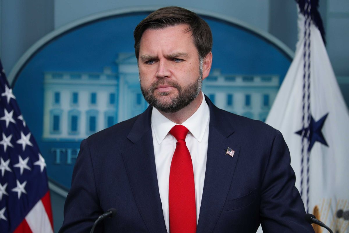 JD Vance standing behind a lectern in the White House press briefing room.