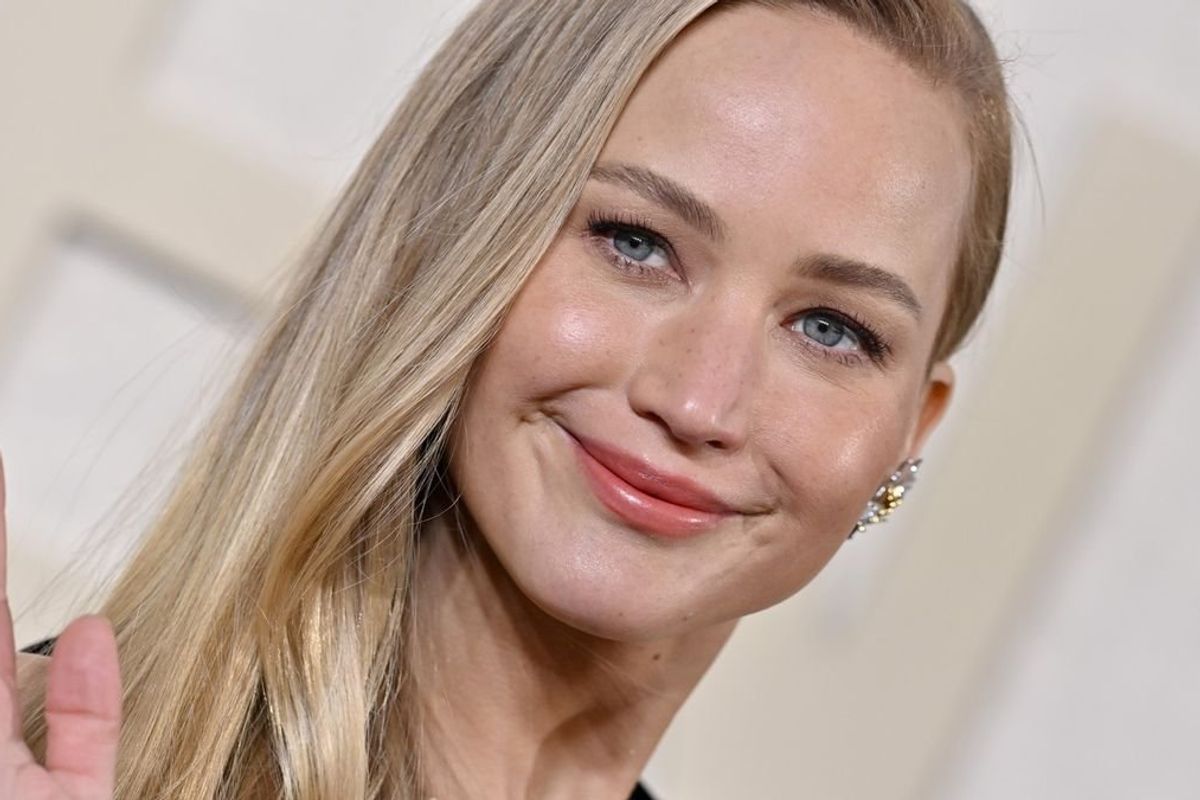Jennifer Lawrence smiles on the red carpet at the Golden Globes