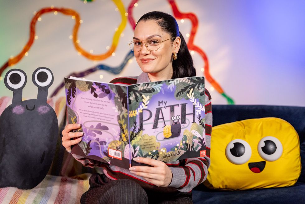 Jessie J reads from a book
