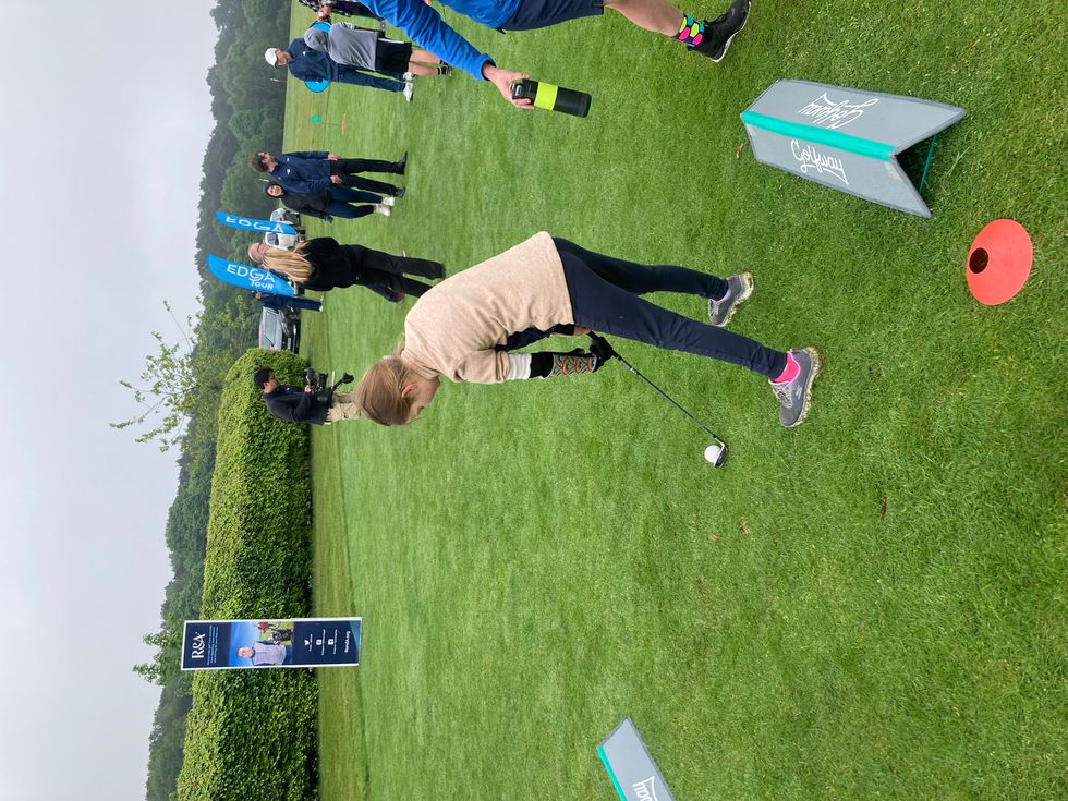 Joanie Melady holding a golf club