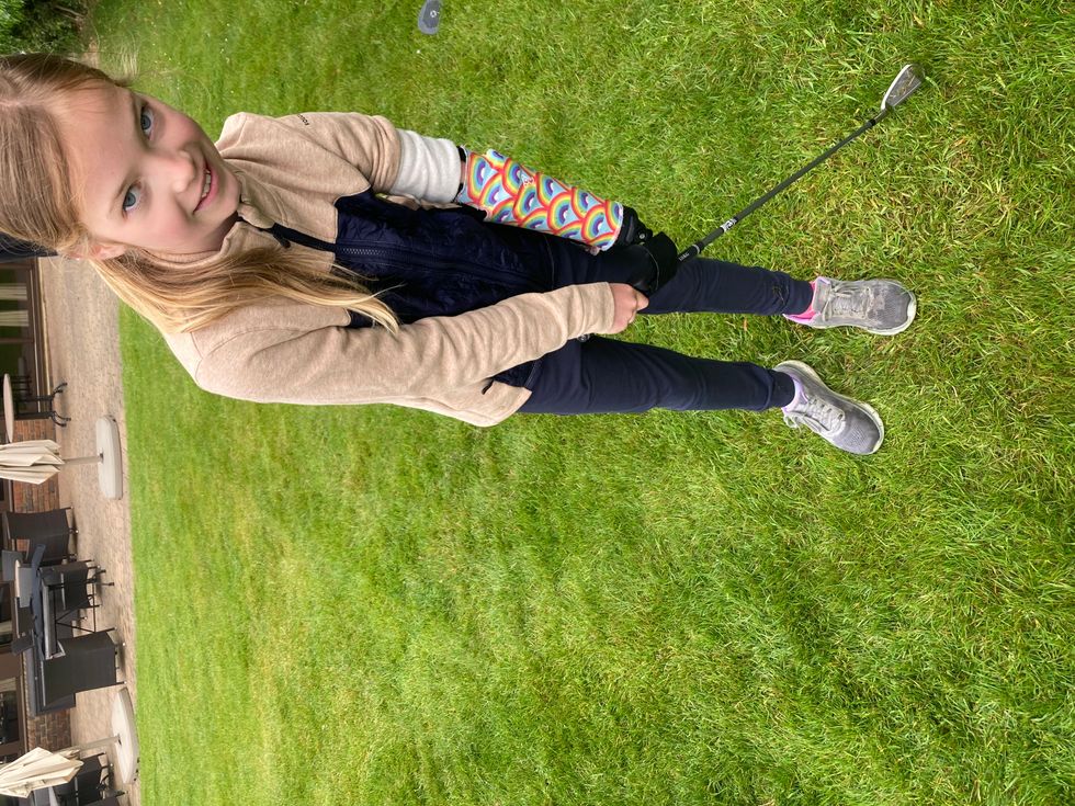 Joanie Melady testing out the golfing tool