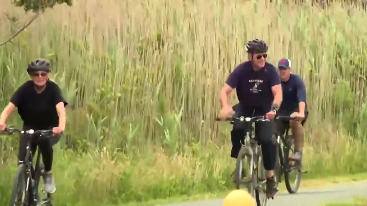 Biden pokes fun at himself when explaining why he fell off his bike