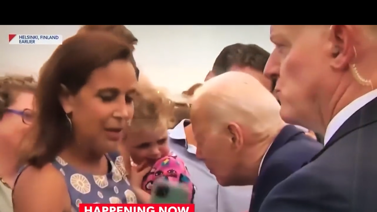 Joe Biden interacting with child in Helsinki