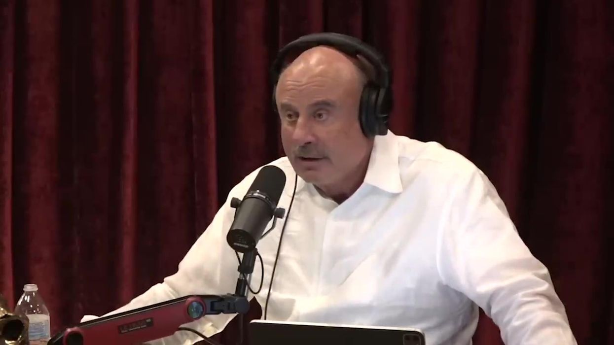 Awkward moment Joe Rogan gets told by producer he's getting mad at fake news