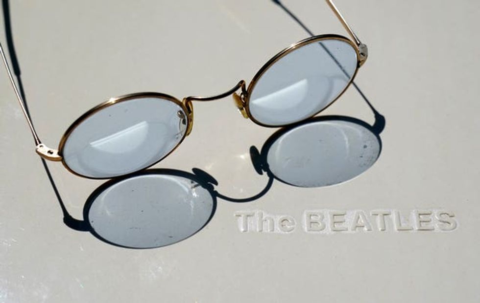 John Lennon-style glasses with blue lenses