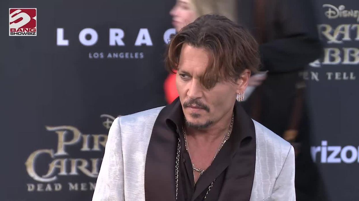 Johnny Depp donating money from his NFTs to a charity linked with Amber Heard
