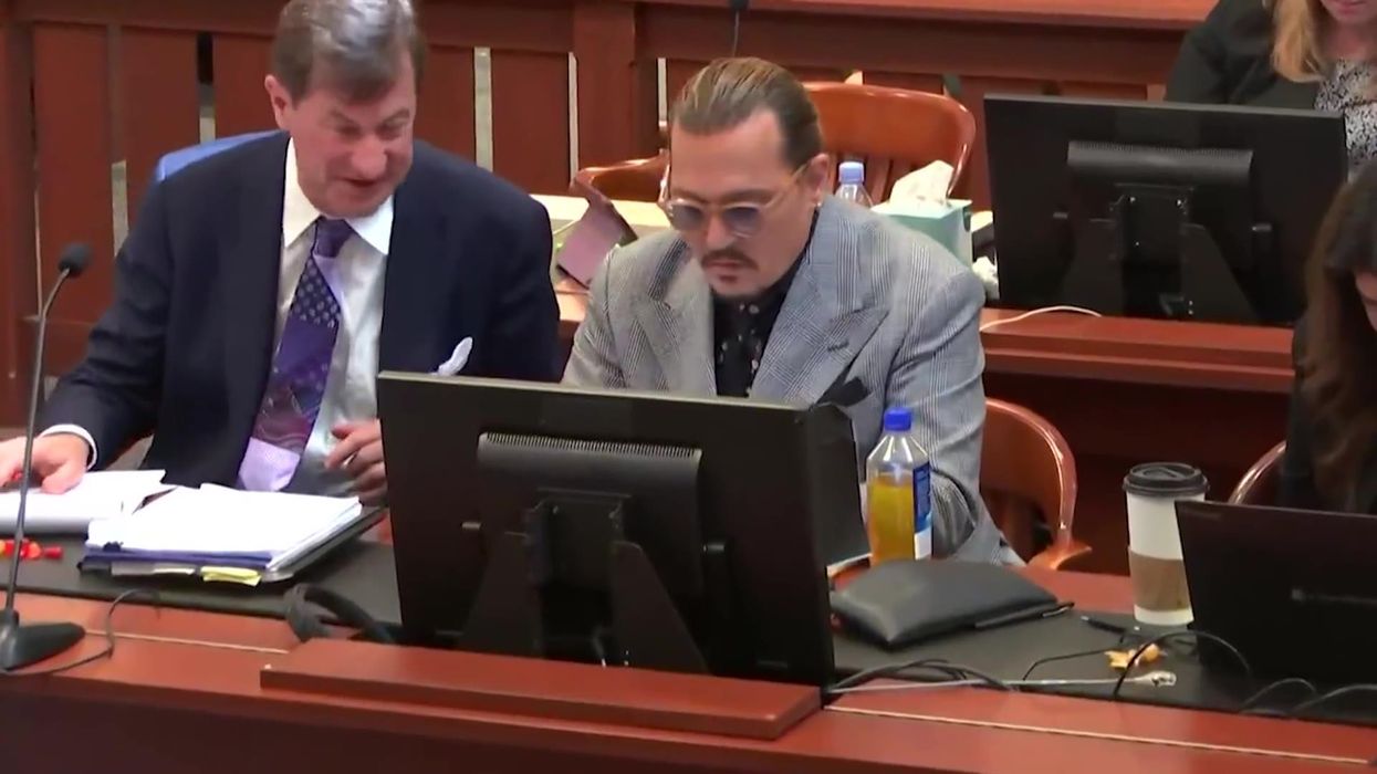 Body language expert says Johnny Depp's flirty interactions with his lawyer are 'deliberate'