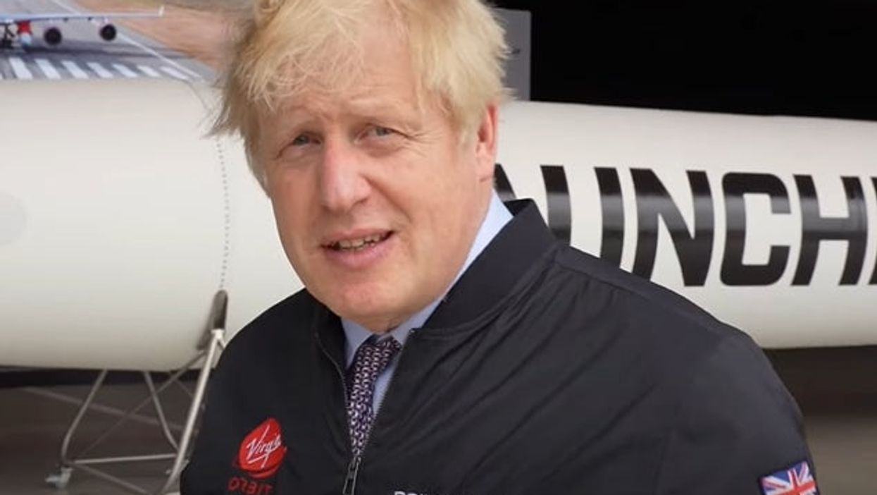 <p>Johnson modelling his new black bomber with his job role and Virgin logo</p>