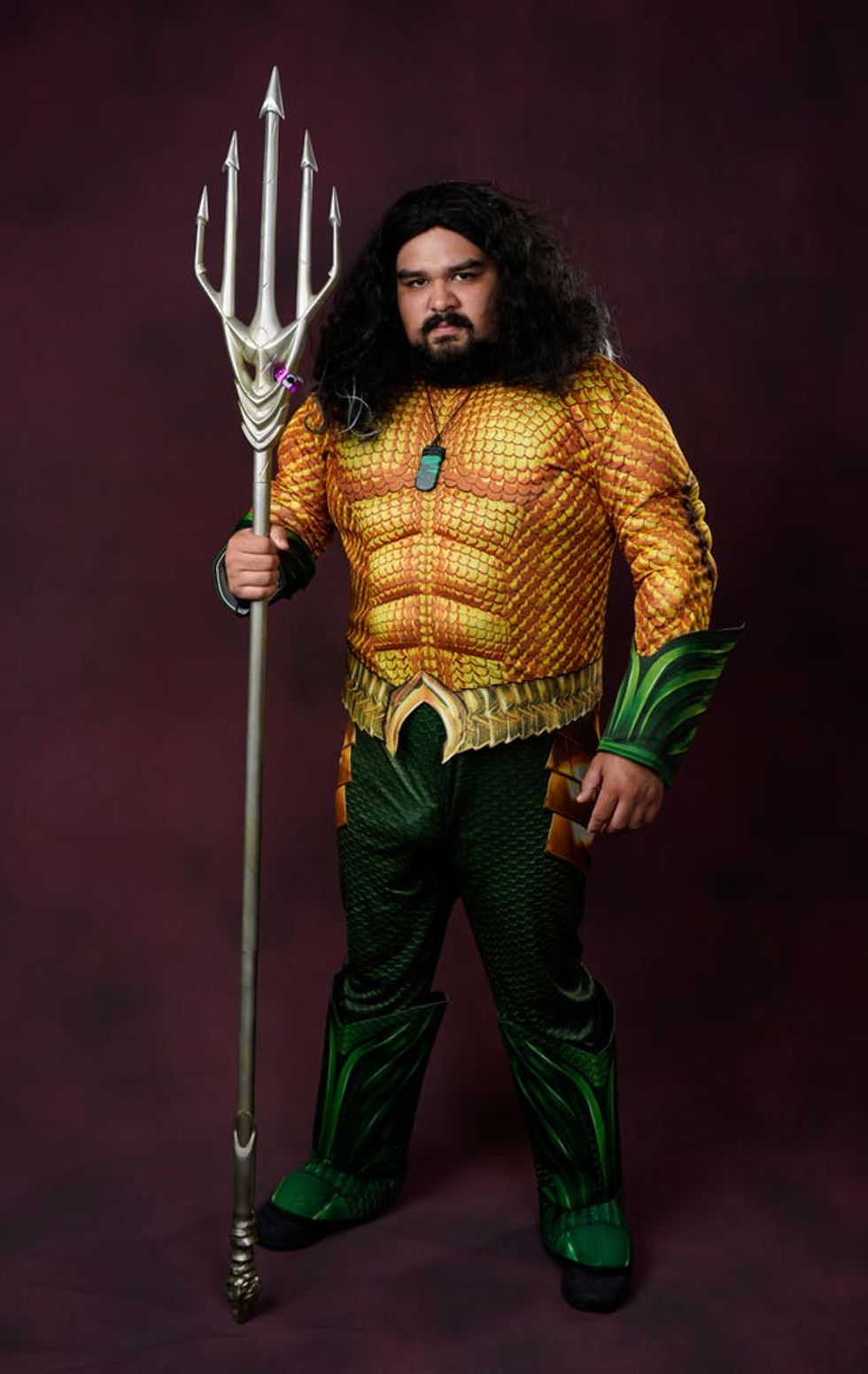 Jose Cuadros, of Escondido, Calif., dressed as Aquaman, poses for a portrait on day one of Comic-Con International on Thursday, July 21, 2022, in San Diego