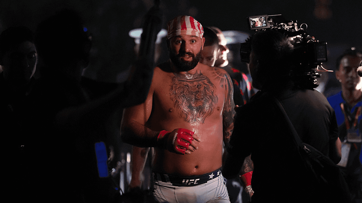 Josh Hokit, a bearded mixed race man with a USA flag as a bandana, after his UFC fight at the White House.