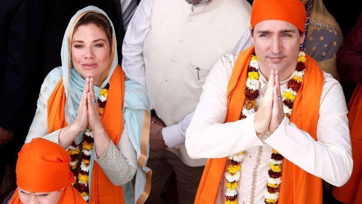 Justin Trudeau and his wife Sophie Gregoire greet the people during their visit to the holy Sikh shrine of Golden temple in Amritsar, India