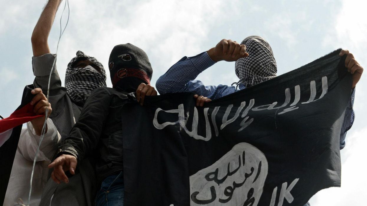 Kashmiri demonstrators hold up an Isis flag in Srinagar on July 18, 2014