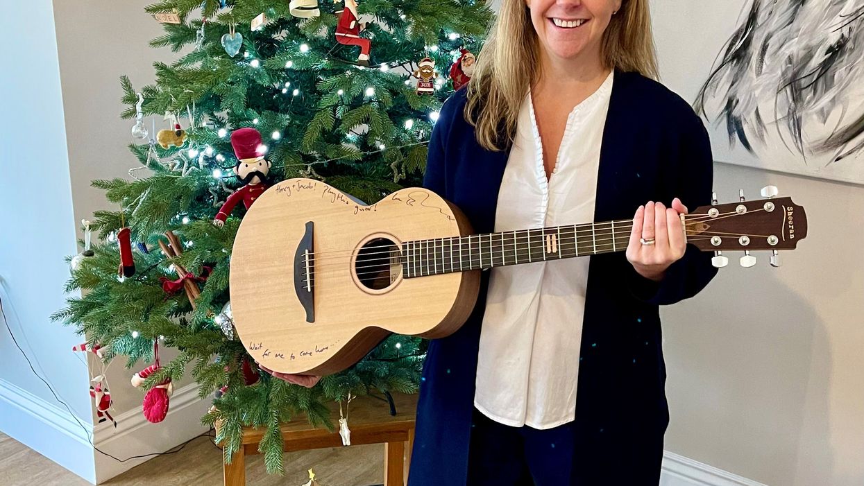 Kellie Myers, of Ipswich, won Ed Sheeran’s prototype Equals guitar in a charity raffle. (GeeWizz/ PA)