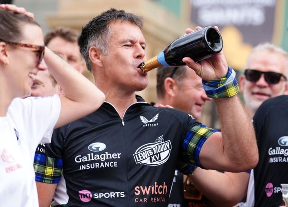 Kenny Logan celebrates after completing the Lewis Moody XV Cycle Challenge ahead of the Gallagher PREM Final at the Allianz Stadium, London