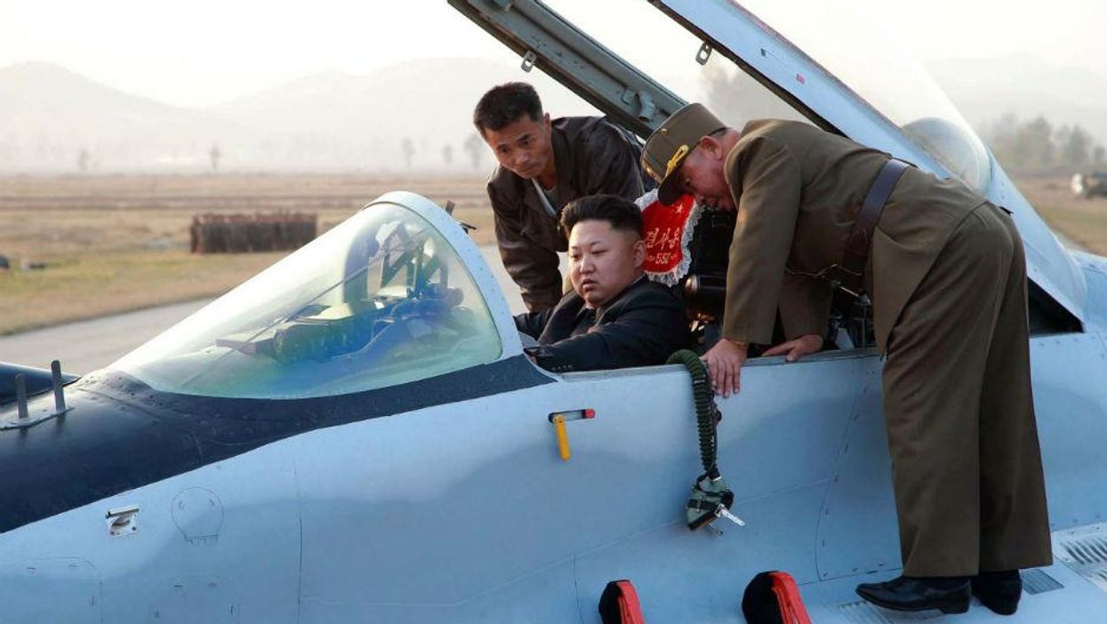 Kim Jong Un inspects a Korean People's Army flight drill at an unnamed location