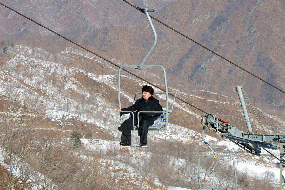 Kim Jong Un rides a ski lift during his inspection tour at the Masikryong resort, near Wonsan, North Korea. Picture: