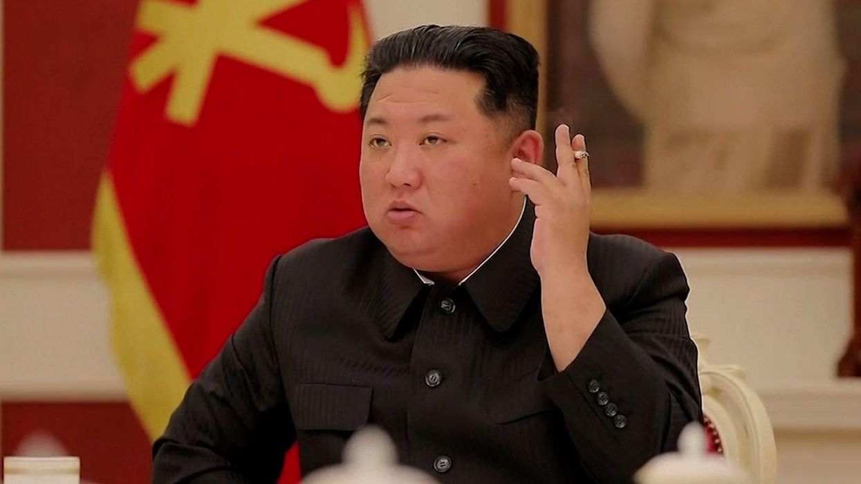 Kim Jong-un waves cigarette around like old Hollywood movie star in Covid meeting