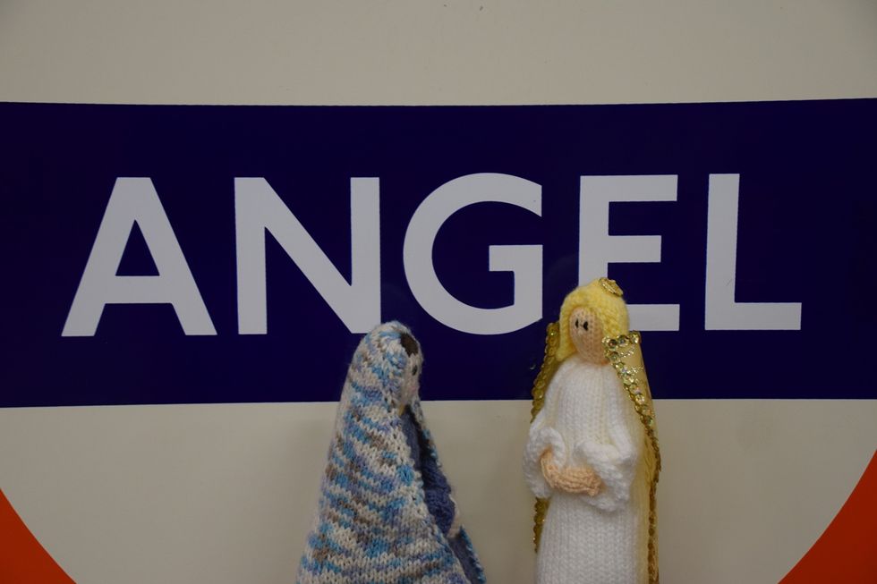 Knitted figures facing each other
