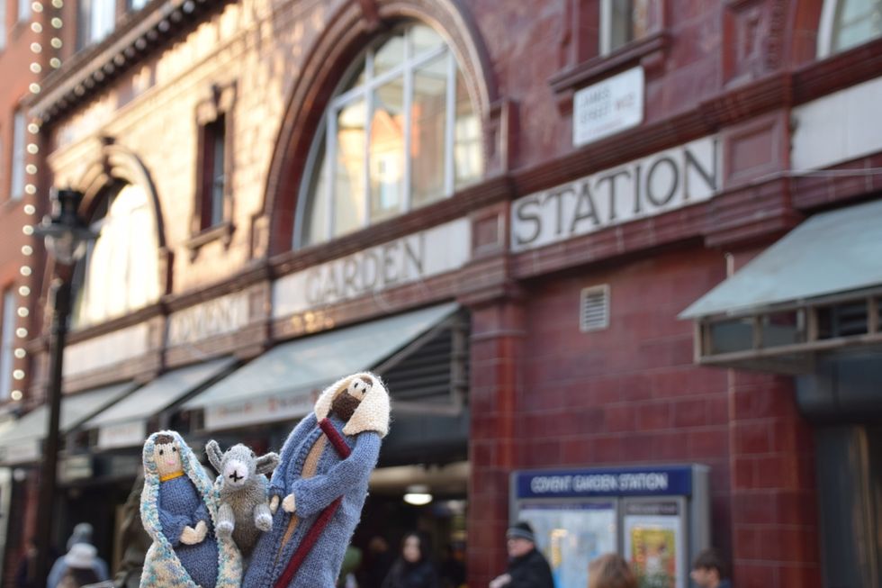 Knitted figures outside station