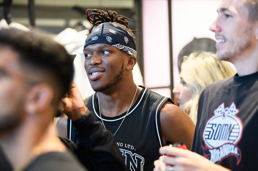 KSI is seen at a surprise visit as YouTube collective 'Sidemen' open their first retail store at Bluewater Shopping Centre on July 15, 2023 in Greenhithe, England