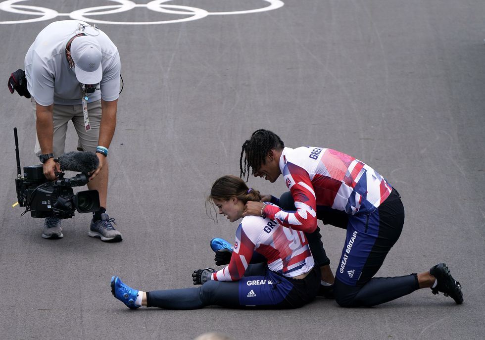 Kye Whyte with Beth Shriever after she collapsed on the track in relief after her gold medal ride (Danny Lawson/PA)