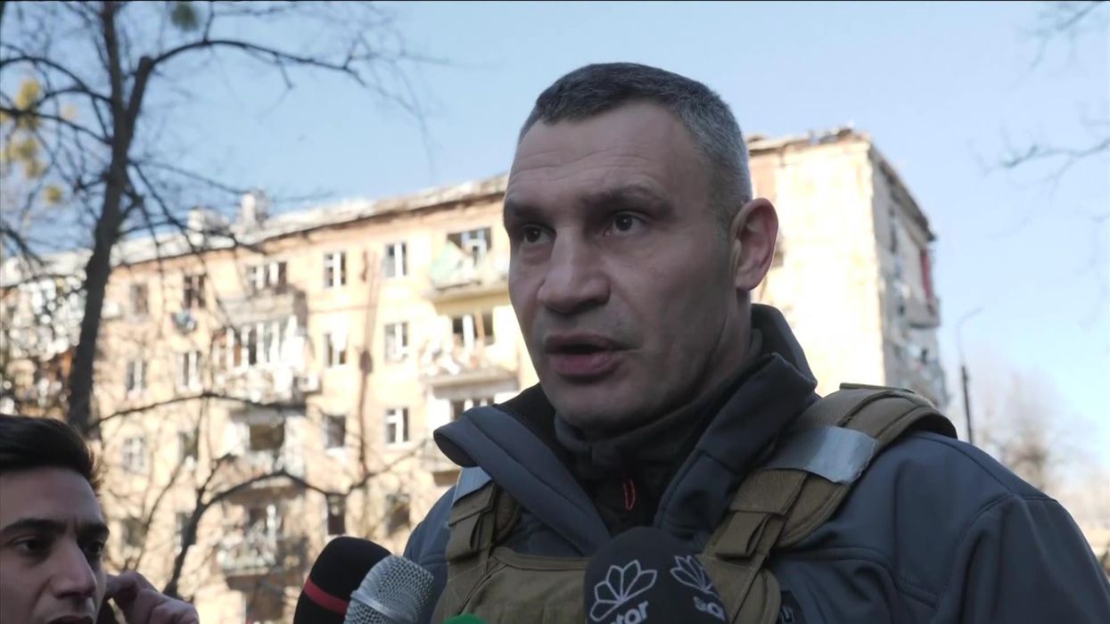 Russian cosmonauts arrive at International Space Station wearing the colours of Ukraine