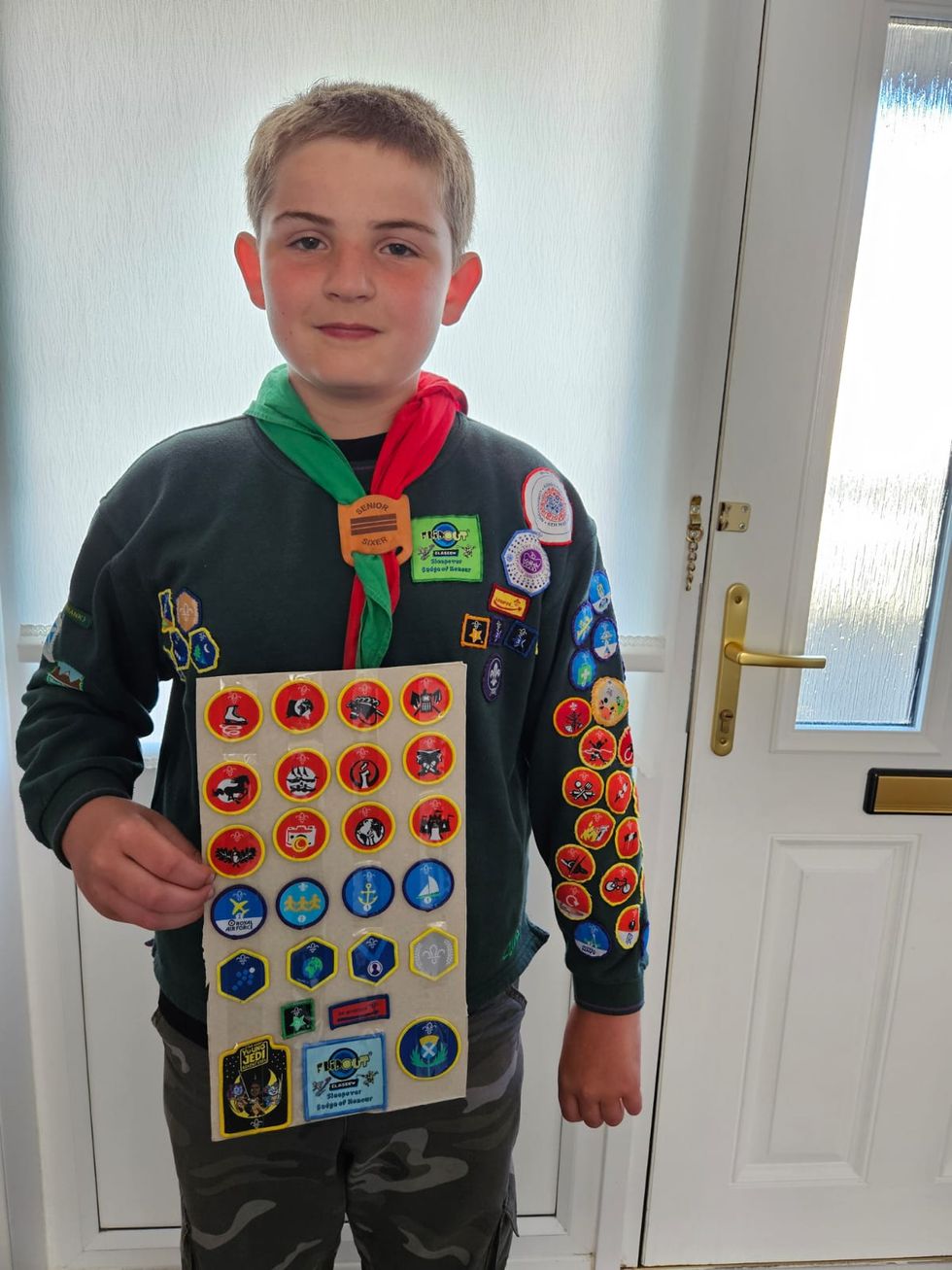 Boy, 10, celebrates achieving all 57 Cubs badges