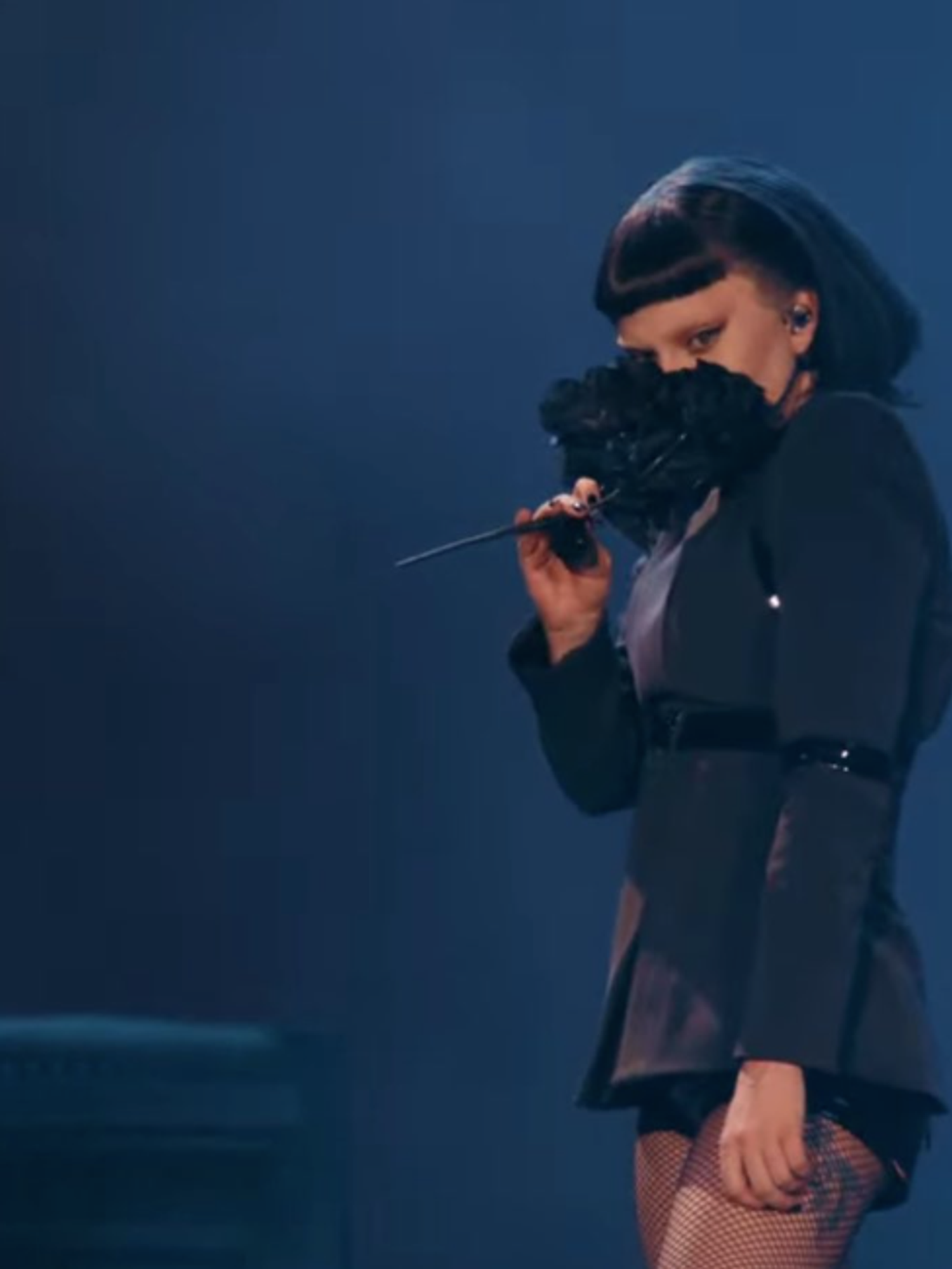 Lady Gaga holding black bouquet of flowers